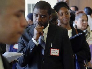 FILE - In this Wednesday Nov. 2, 2016, file photo, job seekers attend a New York Department of Citywide Administrative Services job fair, in New York. On Friday, Dec. 2, 2016, the U.S. government issues the November jobs report. (AP Photo/Bebeto Matthews, File)