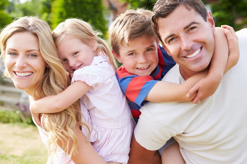 Portrait of smiling family in garden