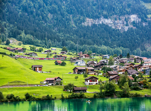 Valley of Lake Lungern or Lungerersee with train in Obwalden, Switzerland.
